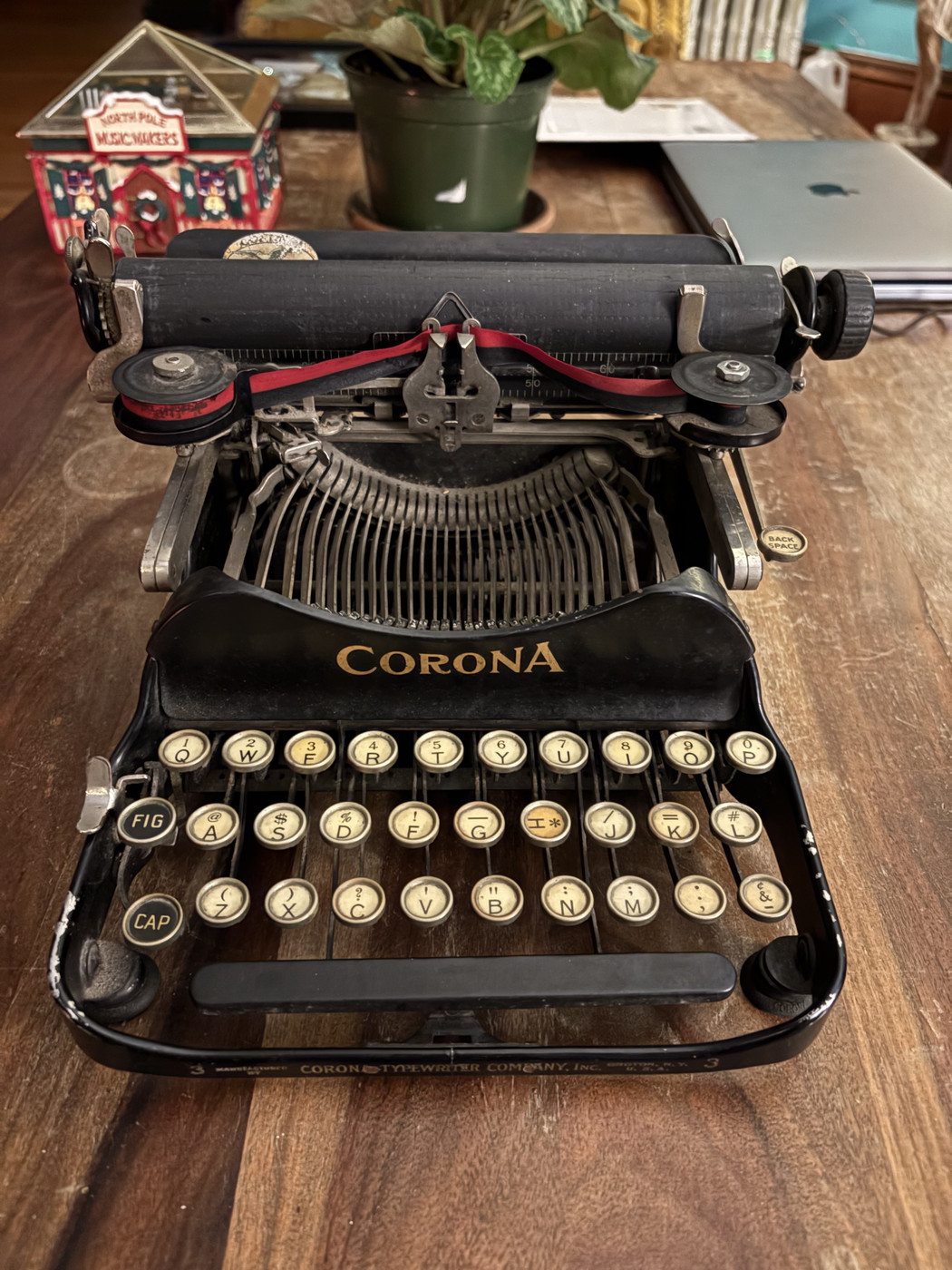 Old Corona manual typewriter on a table