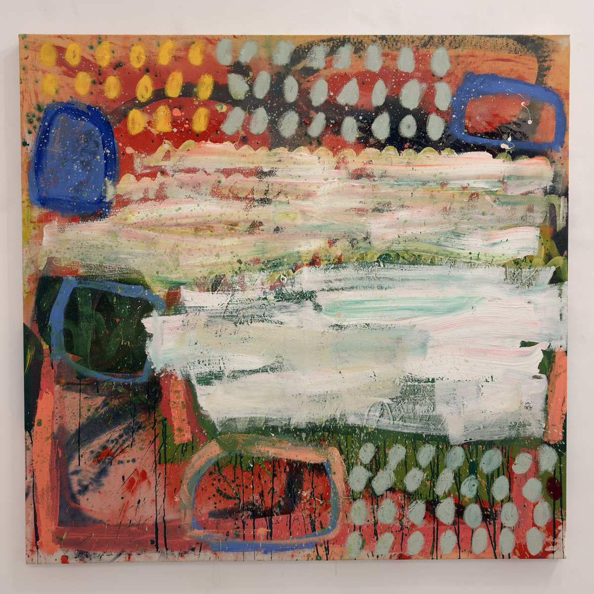 Abstract painting with broad, layered white brushstrokes sweeping across the centre, partially obscuring a vibrant background of red, pink, green and black. Rows of pale oval marks and yellow dabs line the top and lower right, while blue-outlined rounded shapes, paint splatters and dripping black lines add texture and movement throughout the composition.