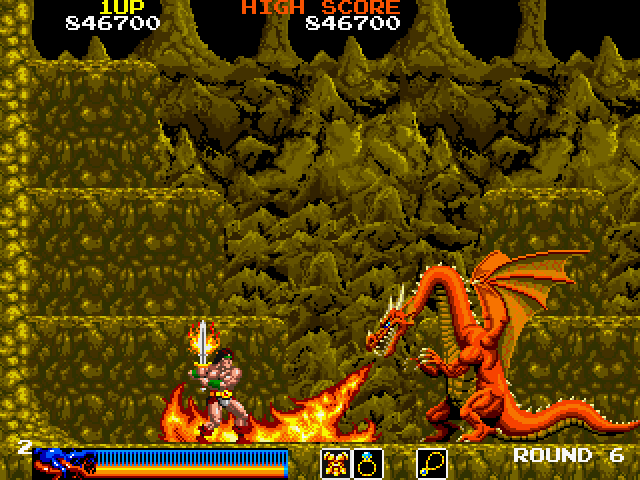 Screenshot of a retro side-scrolling fantasy arcade game showing a small armored knight attacking a large red dragon that is breathing fire, with a rocky cave background and game status bars along the top and bottom.