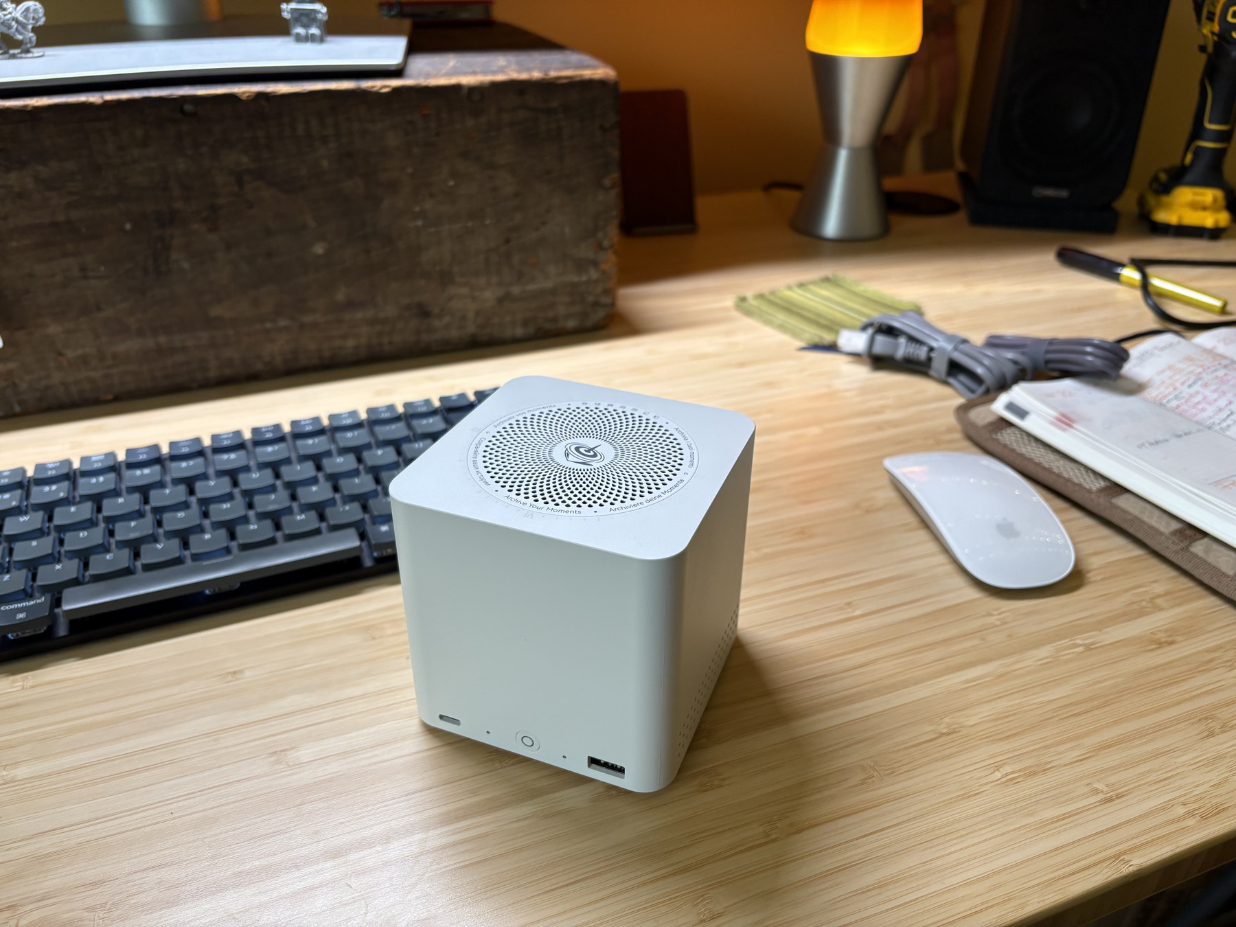 Beelink ME mini on a desk with keyboard and mouse